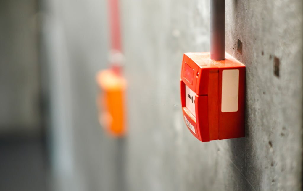 Fire alarm button on concrete wall